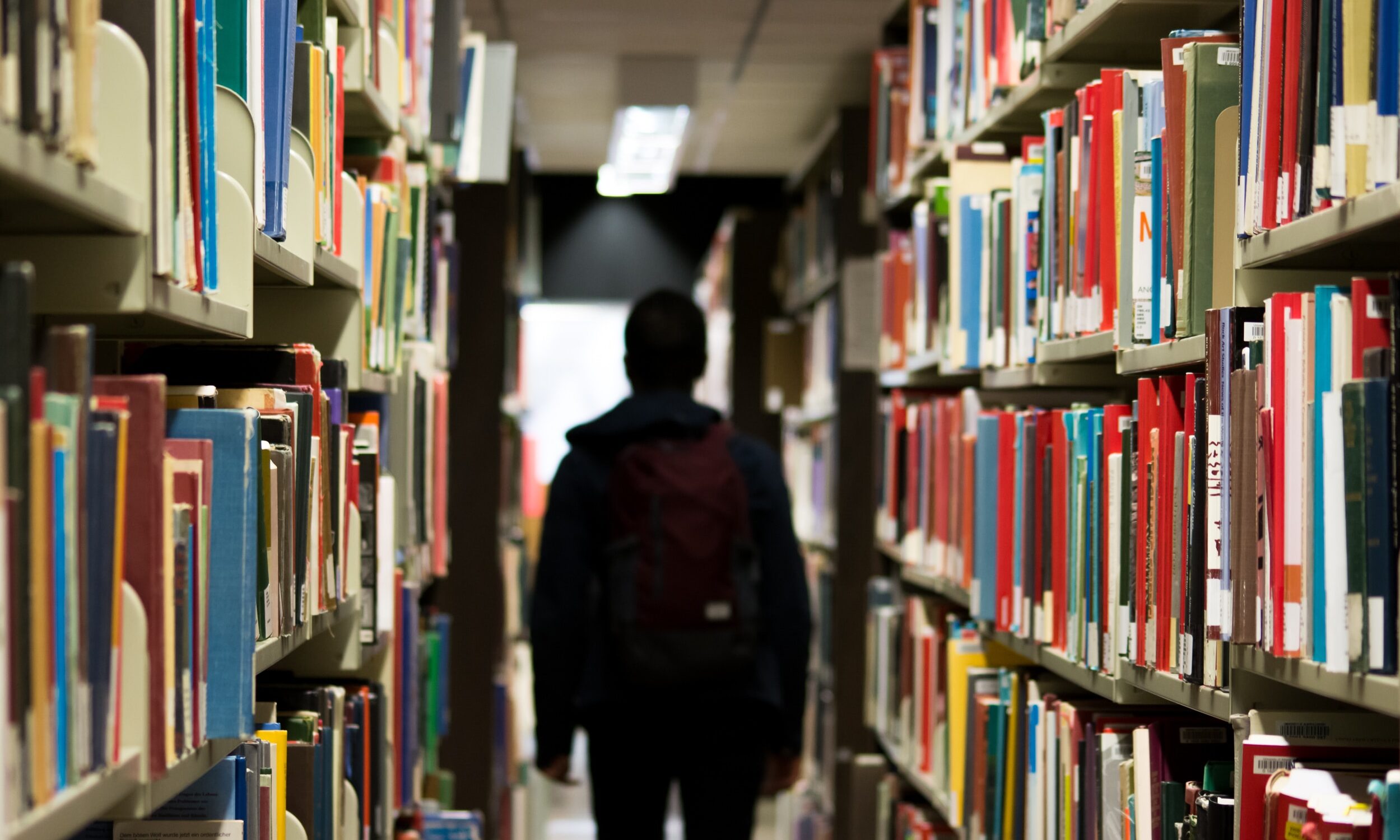 Person walking through a library